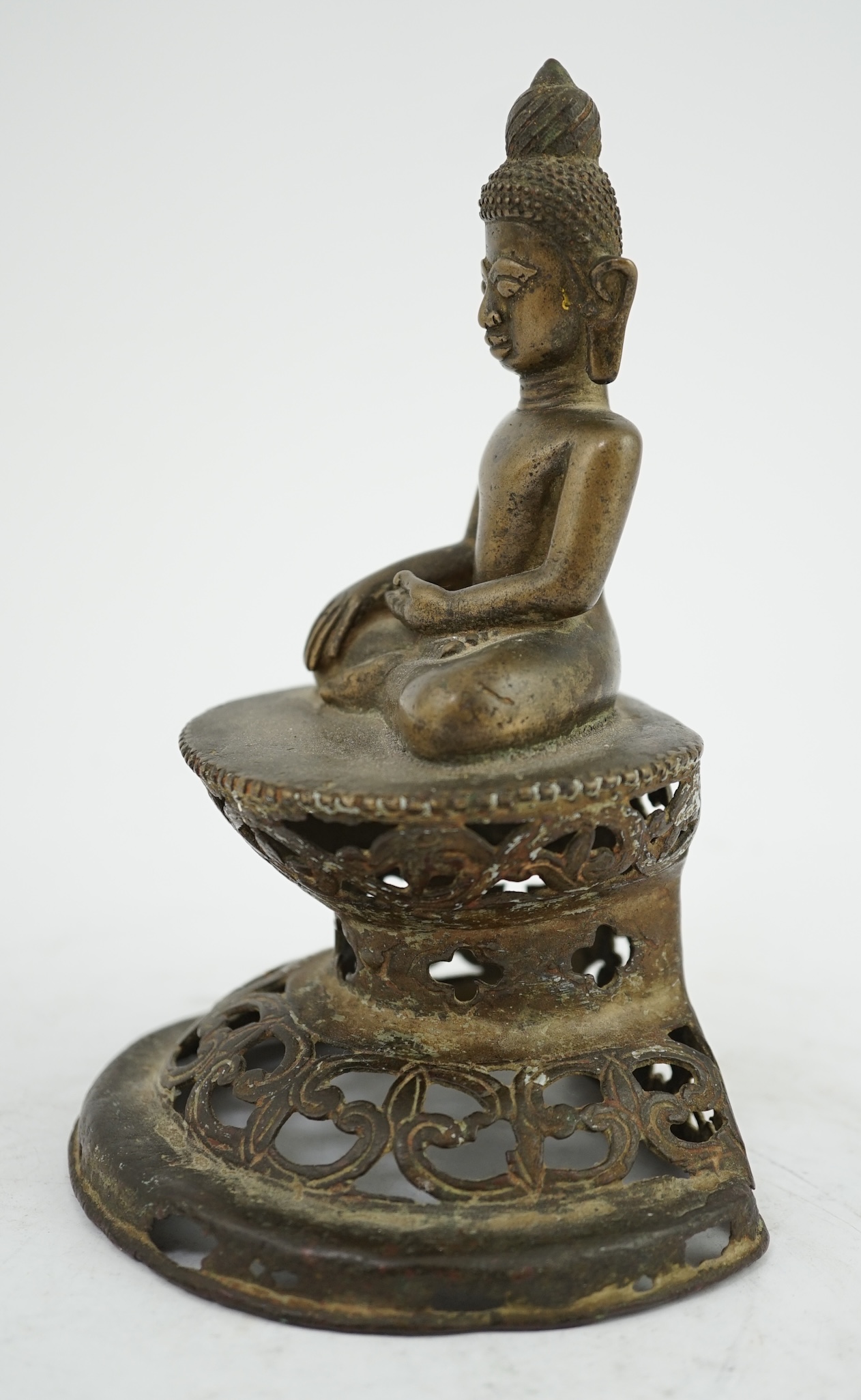 An unusual Burmese bronze seated figure of Buddha, 17th/18th century